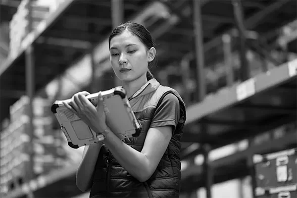 Woman on a tablet in a warehouse