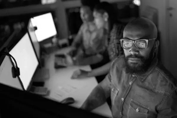 image of a man in front of a computer