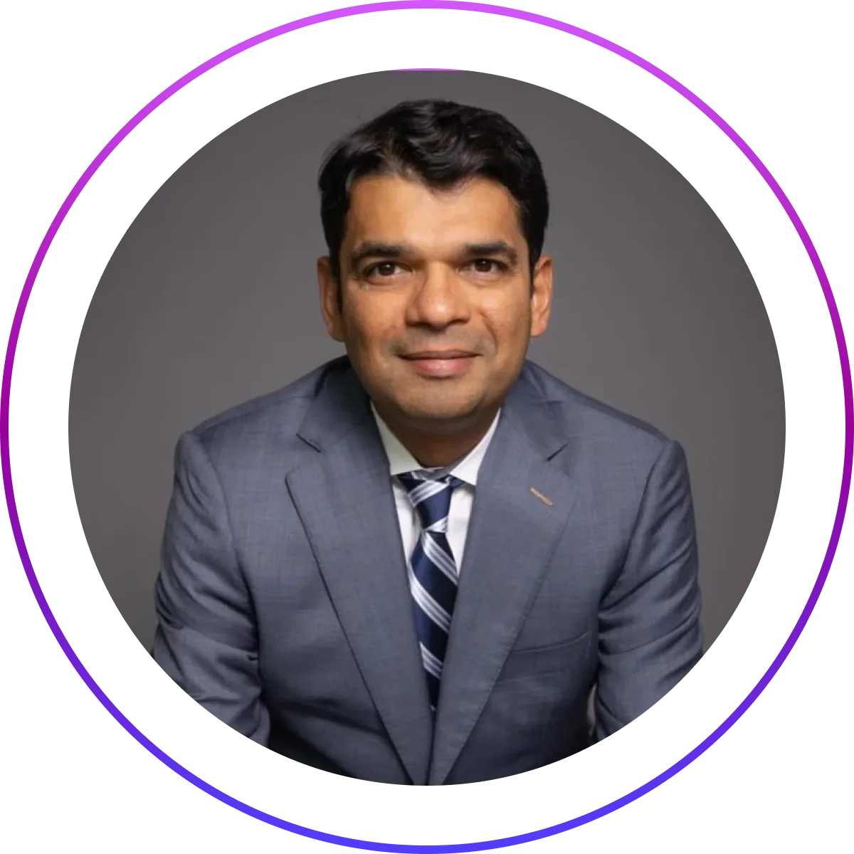 Portrait of Milan Shetti, CEO of Rocket Software, wearing a suit and tie.