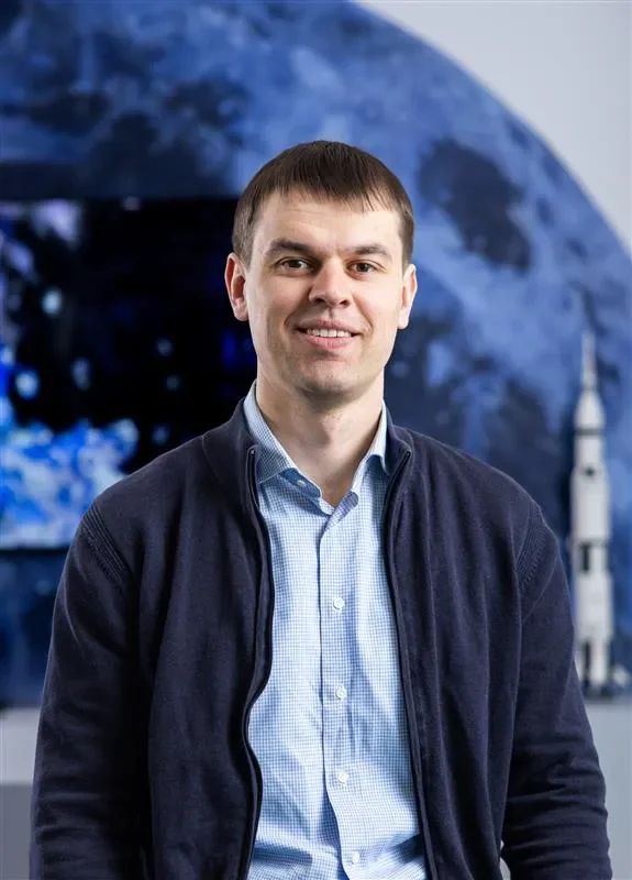 Image of Pavel Taranenko with a moon in the background