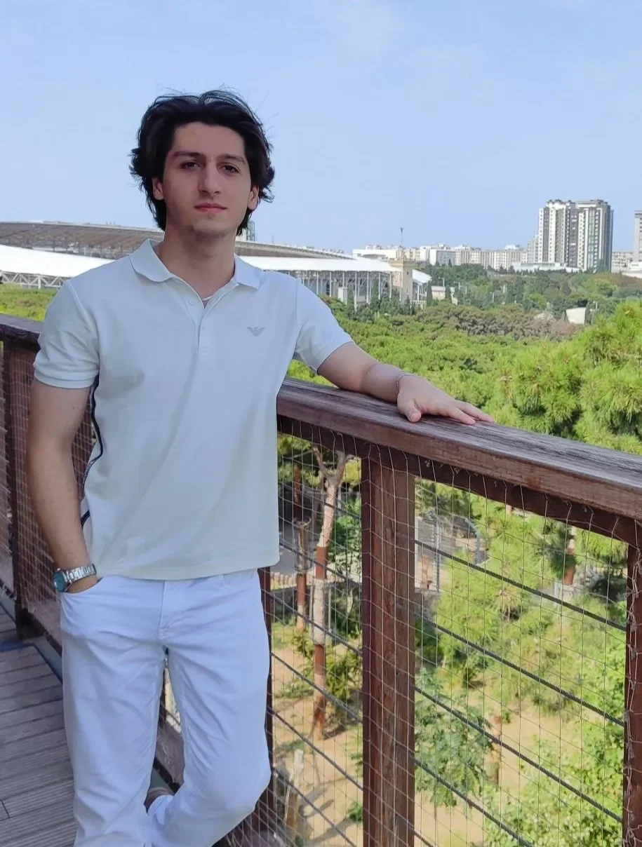 Image of Rustam Habibov witha park and building in the background