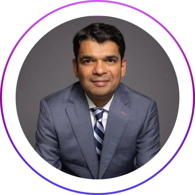 Portrait of Milan Shetti, CEO of Rocket Software, wearing a suit and tie.