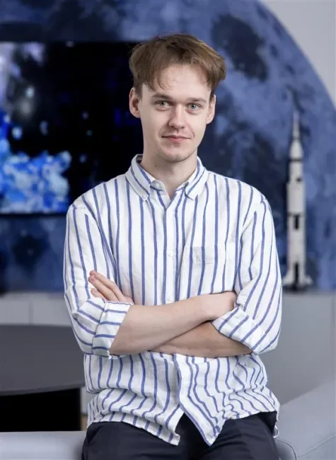 Image of Domanta Kakciukas with a moon bakground
