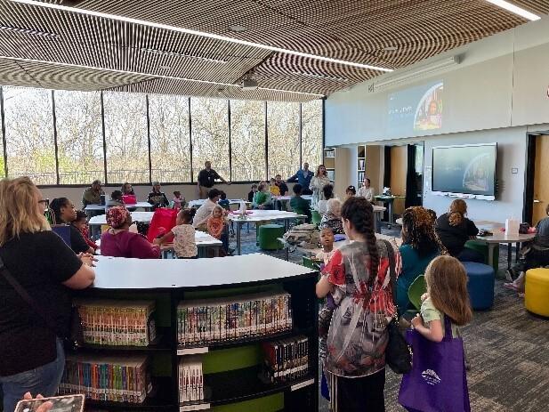 A room full of books and students